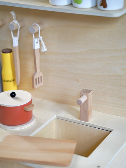 Wooden mini kitchen with cookware